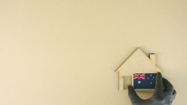 Icono de casa de cartón con bandera de Australia, concepto de mercado inmobiliario — Vídeos de Stock