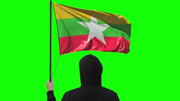 Waving flag of Myanmar and unknown man wearing black, alpha matte — Stock Video