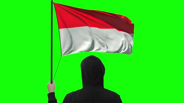 Indonesiens flagga och okänd man, alpha matt — Stockvideo