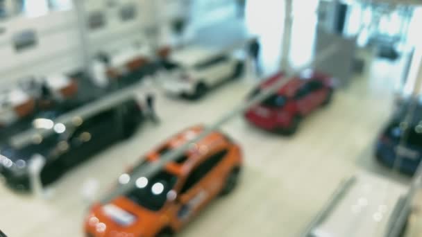 Blurred new cars in a dealership showroom — Stock Video