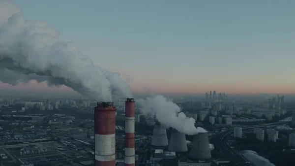 Aerial shot of industrial smoke stacks on Moscow skyline background in the morning, Russia — Foto de Stock