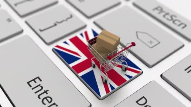 Belanja gerobak di keyboard kunci dengan bendera Inggris. Looping ecommerce terkait animasi 3d — Stok Video