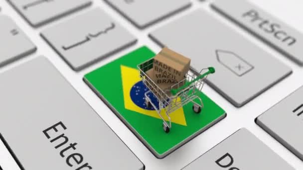 Dozen met MADE IN BRAZIL tekst en winkelwagen op het toetsenbord. Conceptuele looping 3d animatie — Stockvideo