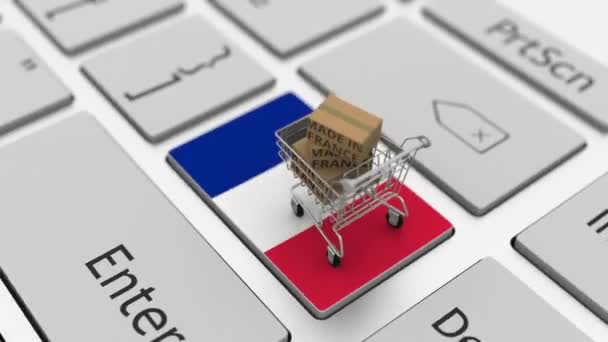 Cajas con texto MADE IN FRANCE y carrito de compras en el teclado. Conceptual looping 3d animación — Vídeo de stock