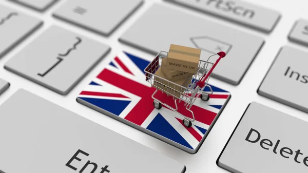 Zboží vyrobené ve Velké Británii v nákupním košíku na klávesnici. Export nebo import konceptů, 3D vykreslování — Stock fotografie