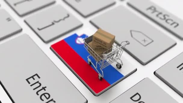 Cartones con texto MADE IN SLOVENIA y carrito de compras en el teclado de la computadora. Conceptual looping 3d animación — Vídeo de stock