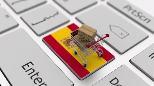 Cajas con texto MADE IN SPAIN y carrito de compras en el teclado. Conceptual looping 3d animación — Vídeo de stock