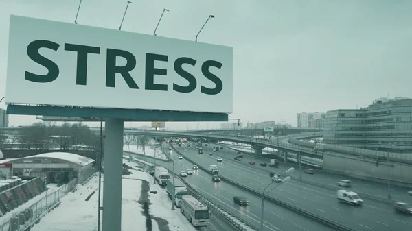 Luchtfoto van een reclamebord met STRESS-tekst op de stedelijke snelweg in de winter — Stockfoto