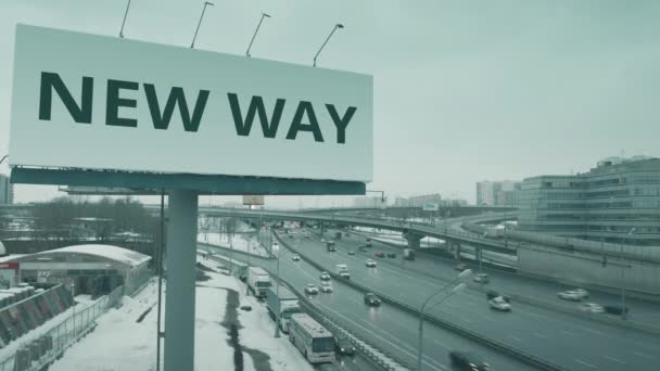 Vedere aeriană a unui panou publicitar cu text NEW WAY pe autostrada urbană iarna — Videoclip de stoc