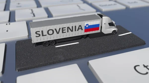 Прапор Словенії на рухомій вантажівці та комп'ютерній клавіатурі. Міжнародні перевезення пов'язані 3d рендеринга — стокове фото