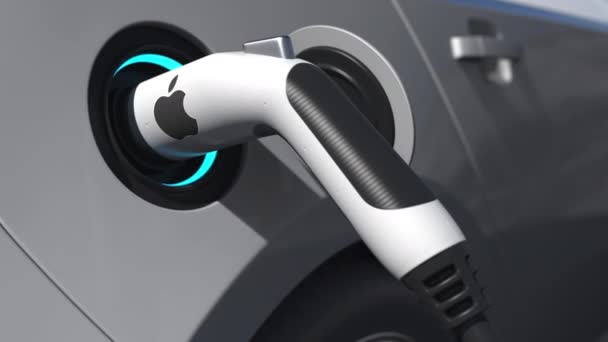 APPLE INC in Verbindung setzen. Logo auf der Steckdose des Elektroautos. Redaktionelle konzeptionelle 3D-Animation — Stockvideo