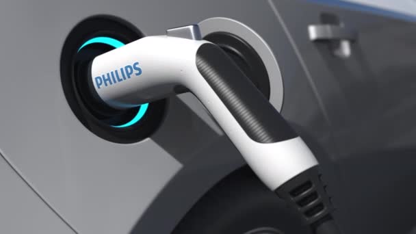 PHILIPS-Logo auf der Steckdose des Elektroautos. Redaktionelle konzeptionelle 3D-Animation — Stockvideo