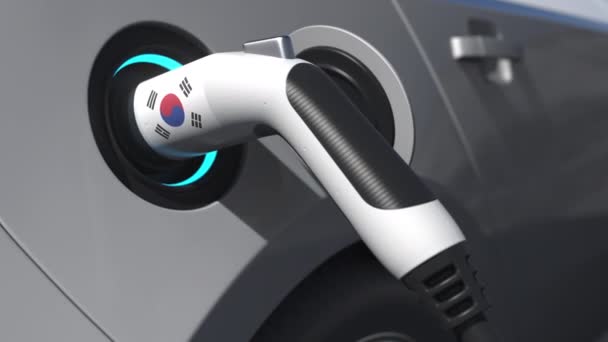 Stecken Sie ein modernes Elektroauto mit südkoreanischer Flagge ein. Konzeptionelle 3D-Animation — Stockvideo