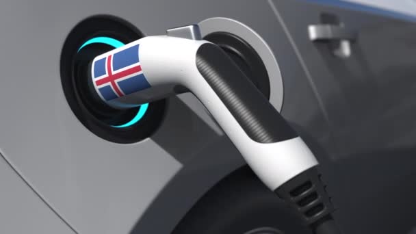 Bandera de Islandia en el enchufe de carga de un coche eléctrico. Animación 3D conceptual — Vídeo de stock