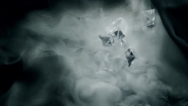 Crystals of ice and curling smoke slow motion shot — Stock Video