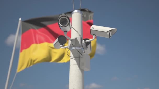 Ondeando la bandera de Alemania y las cámaras de seguridad en el poste. Looping animación 3d — Vídeo de stock