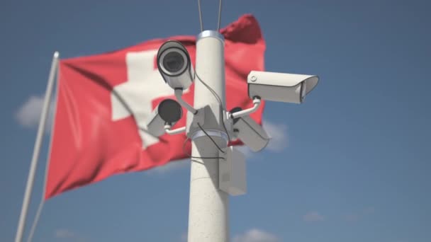 Outdoor security cameras on the pole near flag of Switzerland. Looping 3d animation — Stockvideo