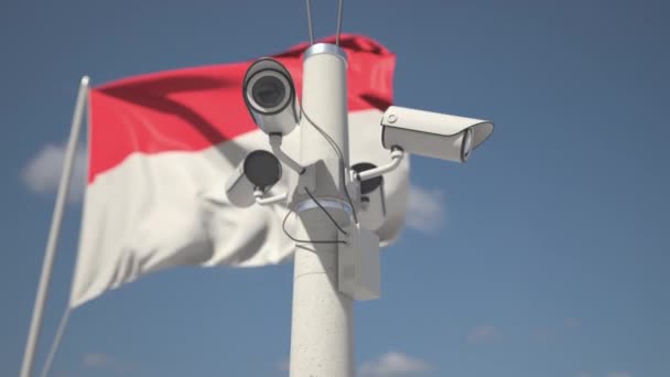 Acenando bandeira da Indonésia e as câmeras de segurança no pólo. Looping animação 3d — Vídeo de Stock