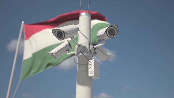 Acenando bandeira da Hungria e as câmeras de segurança no pólo. Looping animação 3d — Vídeo de Stock