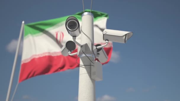 A acenar com a bandeira do Irão e as câmaras de segurança no poste. Looping animação 3d — Vídeo de Stock