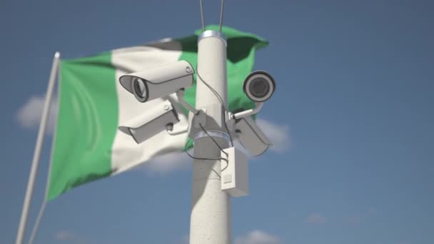 Waving flag of Nigeria and the security cameras on the pole. Looping 3d animation — Vídeos de Stock