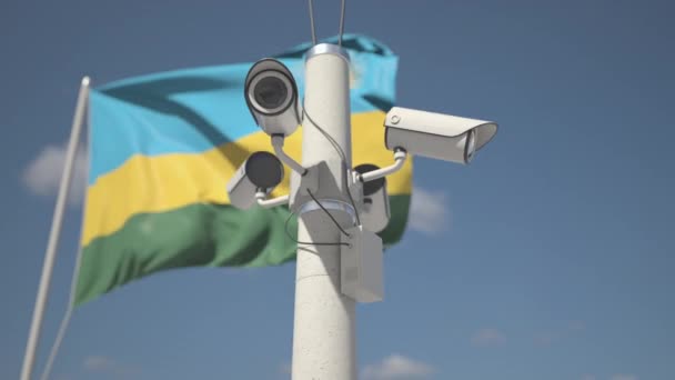 Säkerhetskameror på stolpen nära Rwandas flagga, looping 3D-animation — Stockvideo