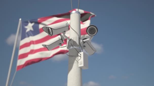 A acenar com a bandeira da Libéria e as câmaras de segurança no poste. Looping animação 3d — Vídeo de Stock