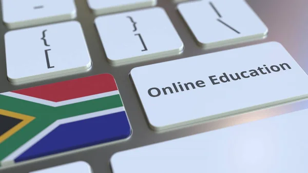 Online Eğitim metni ve Güney Afrika bayrağı bilgisayar klavyesinde. Modern profesyonel eğitim ile ilgili kavramsal 3B oluşturma — Stok fotoğraf