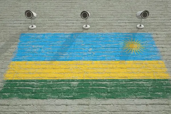 Камери спостереження та стіни з друкованим прапором Руанди. Концепція національної системи безпеки. 3D візуалізація — стокове фото