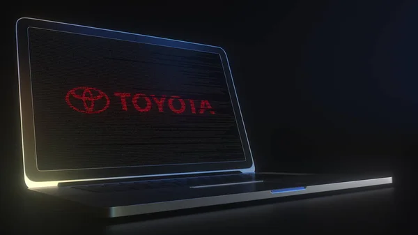 Laptop ekranında bilgisayar kodlu TOYOTA logosu var. Editörel kavramsal 3d oluşturma — Stok fotoğraf