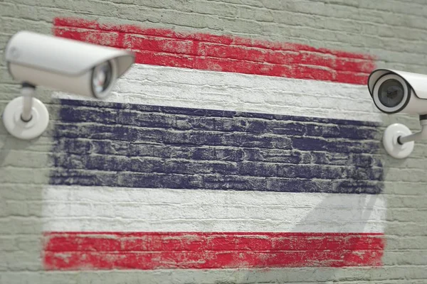 Überwachungskameras und Wand mit thailändischer Flagge. Modernes sicherheitsbezogenes 3D-Rendering — Stockfoto