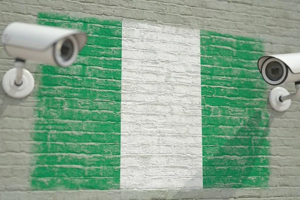 監視カメラとナイジェリアの旗と壁。現代のセキュリティ関連の3Dレンダリング — ストック写真
