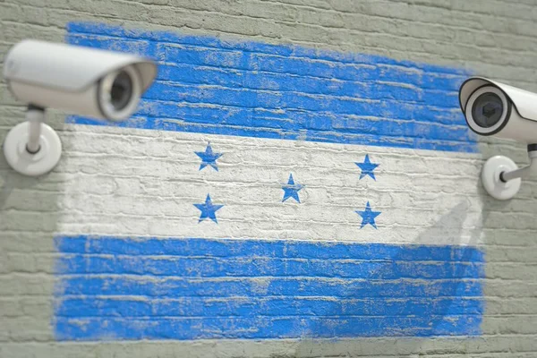 Camere de supraveghere şi perete cu steagul Hondurasului. Redare 3D legată de securitate modernă — Fotografie, imagine de stoc