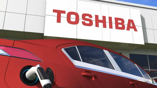 Logo TOSHIBA et prise de voiture électrique. Editorial conceptuel 3d rendu 3d — Photo
