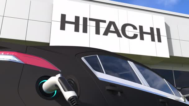 Töltés elektromos autó dugó és HITACHI logó. Szerkesztői konceptuális 3D animáció — Stock videók