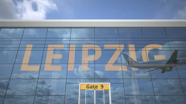 LEIPZIG text revealed with landing airplane on airport building. 3d rendering — Stock Photo, Image