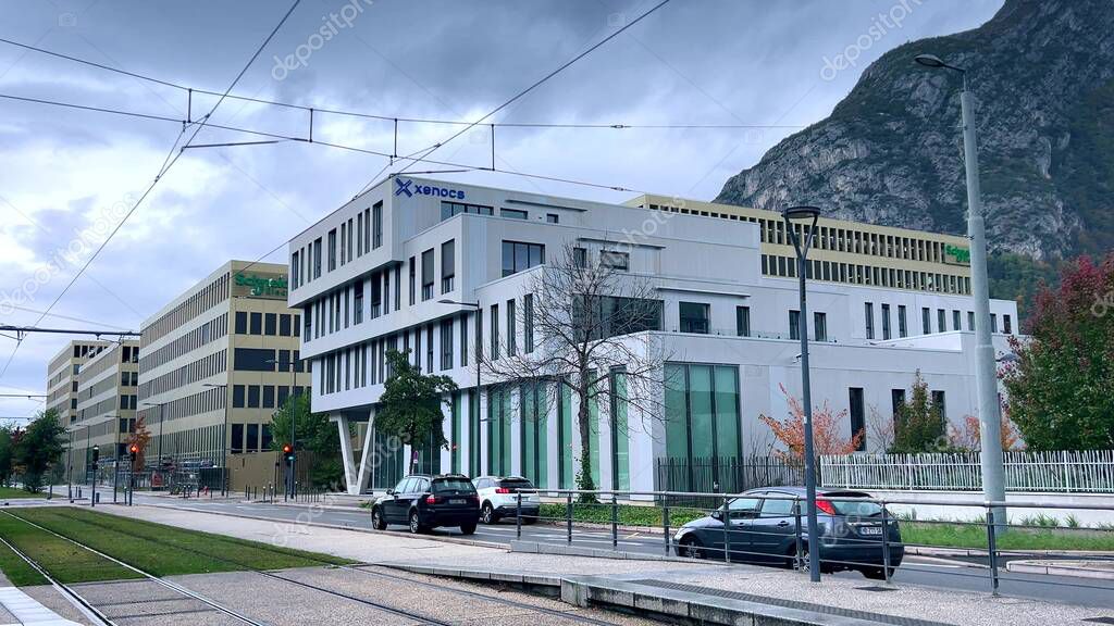 View of Xenocs and Schneider Electric office buildings in the Presquile scientific district of Grenoble, France, known for research and technology companies