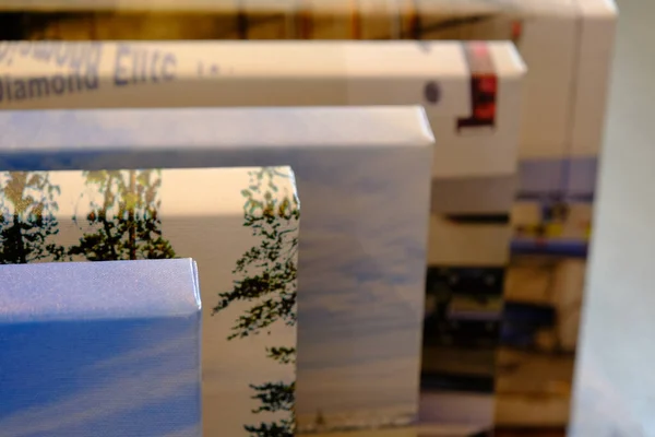 Stack of Canvas Gallery wrap prints from the side — Stock Photo, Image