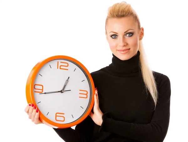 Calm smiling woman with big orange clock gesturing no rush, enou — Stock Photo, Image