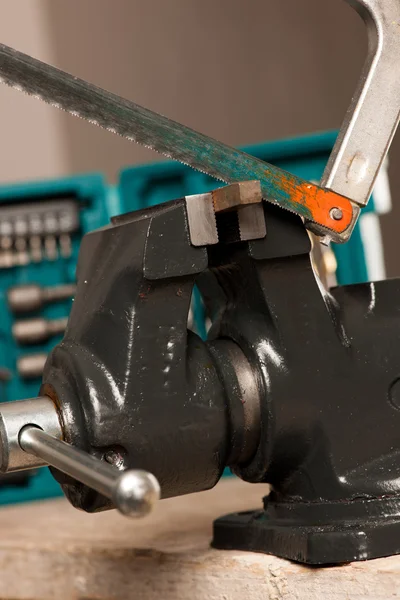 Cutting iron with saw on vice tool, clamping device. — Stock Photo, Image