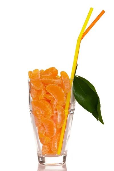 Big glass filled with orange mandarin citrus fruit slices, decor — Stock Photo, Image