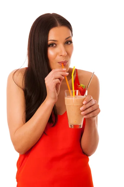 Žena pít zdravé ovoce lichotníku zdobený červenou s — Stock fotografie