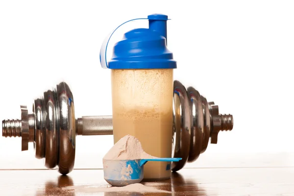 Whey protein powder in scoop, dumbbell, meter tape and plastic s — Stock Photo, Image