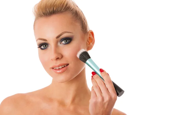 Portrait of woman holding beauty accessories, mascara, pauder br — Stock Photo, Image