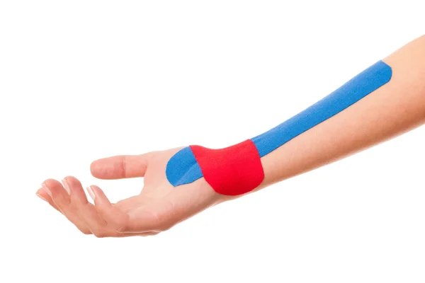 Physiotherapy - Arm stabilised with kinesotape after injury — Stock Photo, Image