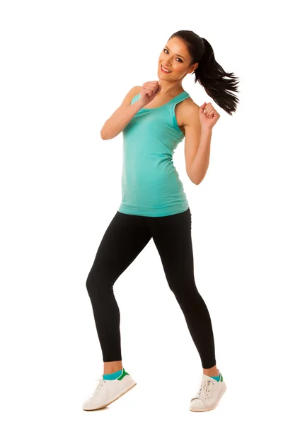 Happy fit and slim woman dancing and jumping isolated over white — Stock Photo, Image