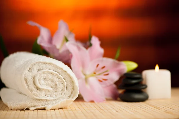 Spa concept of lily flower, towels, sea salt, candle and crystal — Stock Photo, Image