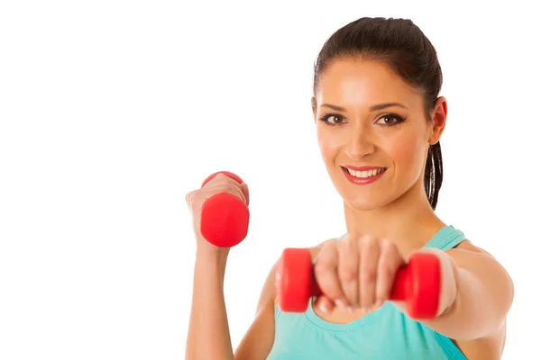 Mujer activa con pesas entrenamiento en gimnasio de fitness aislado sobre —  Fotos de Stock