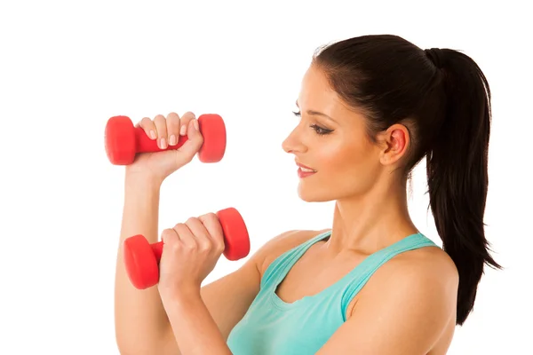 Aktive Frau mit Kurzhanteln trainiert in Fitnessstudio isoliert über — Stockfoto