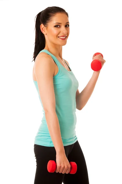 Active woman with dumbbells workout in fitness gym isolated over — Stock Photo, Image